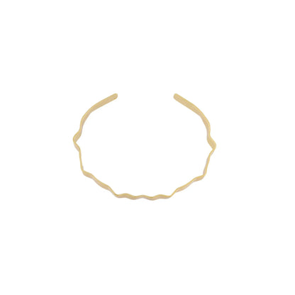 Alaya Small Wave Cuff bracelet. Gold plated. Dansk Copenhagen