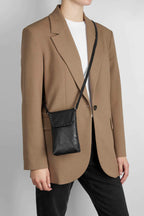 LuccaMBG mobile bag with strap. Whipstitch model. Black. Leather. Markberg