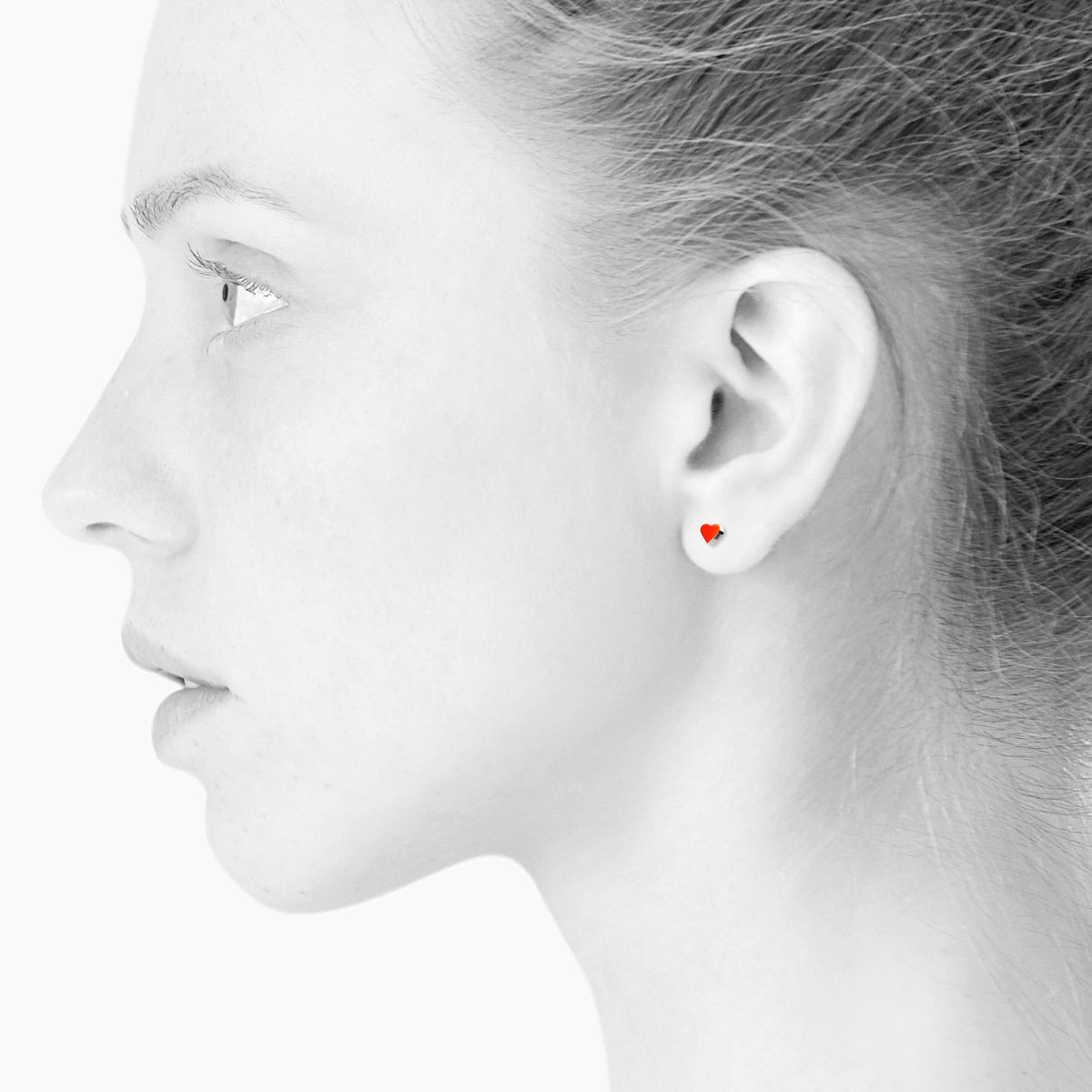 Sign Heart nano earrings. Neon red orange. Sterling silver. Scherning Copenhagen