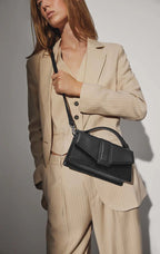 ZoeMBG crossbody bag. Black and gold. Leather. Markberg
