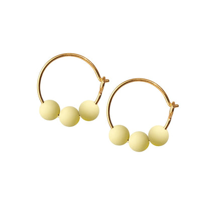 Glow hoop creole earrings. Lemon. Scherning Copenhagen
