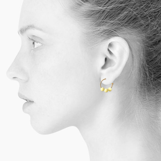 Glow hoop creole earrings. Lemon. Scherning Copenhagen